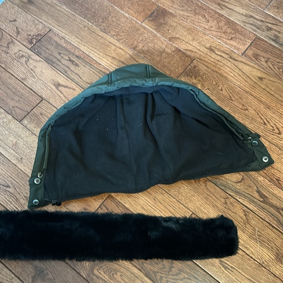 Convertible and cozy warm winter puffer in dark green with black accents - Picture 9 of 10
